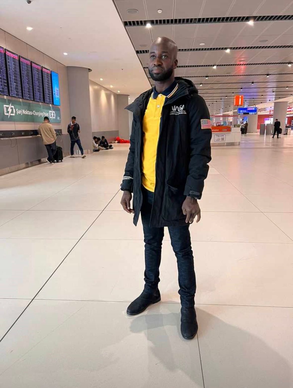 UpVoice Academy student at the airport departure hall heading to Germany