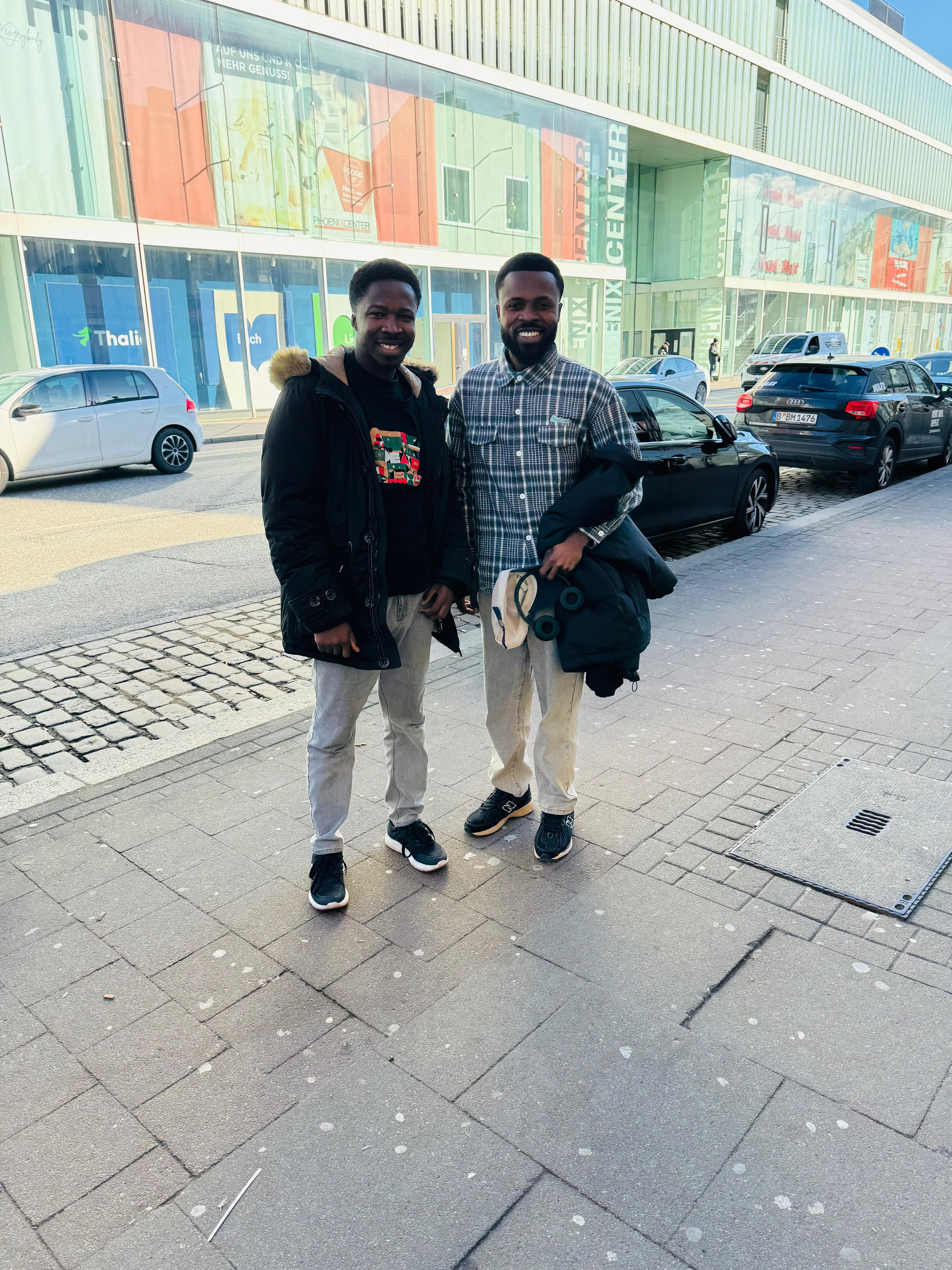 UpVoice Academy student smiling at the airport ready to start life in Germany