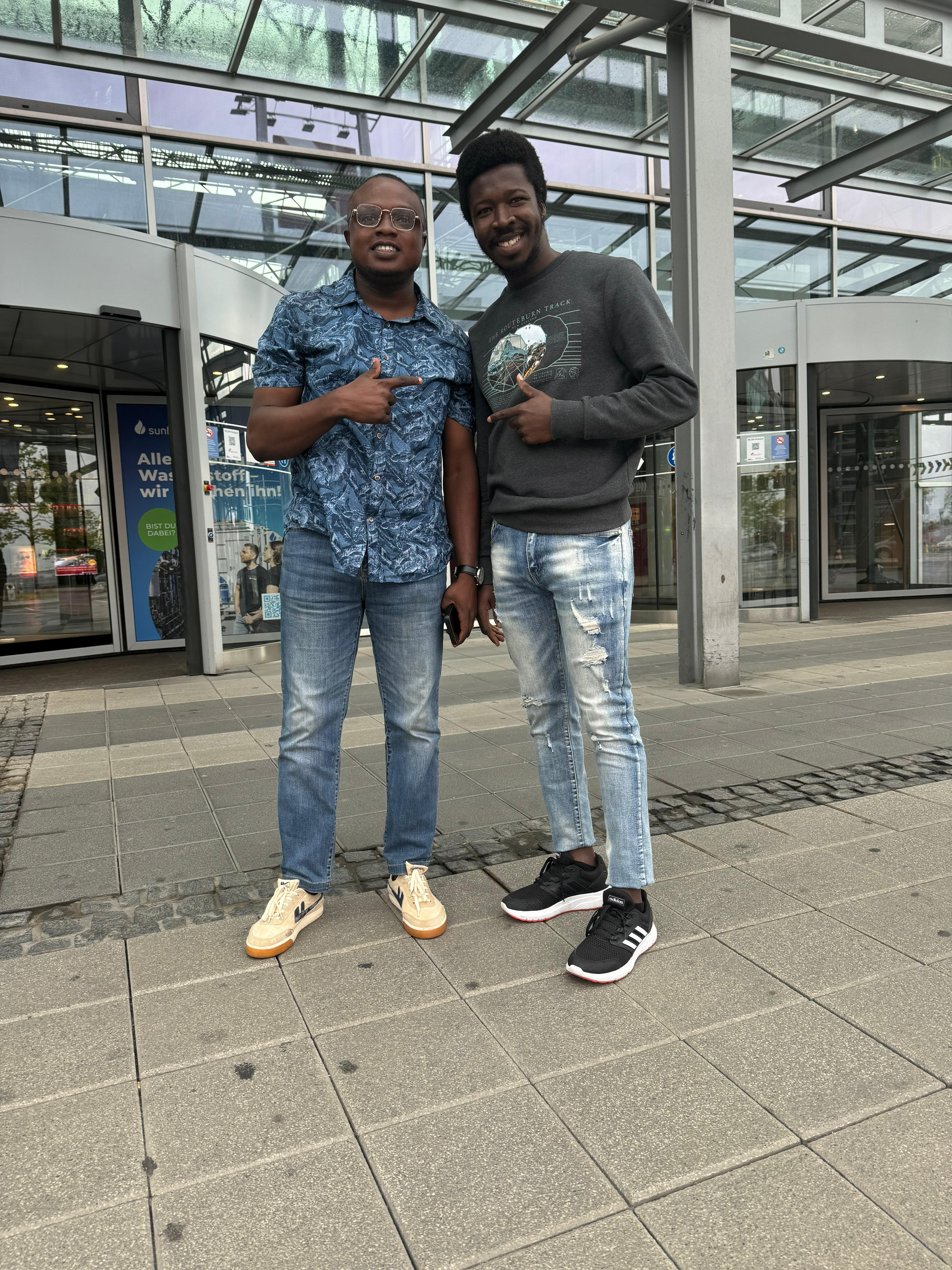 UpVoice Academy student posing at a German landmark after arriving in the country