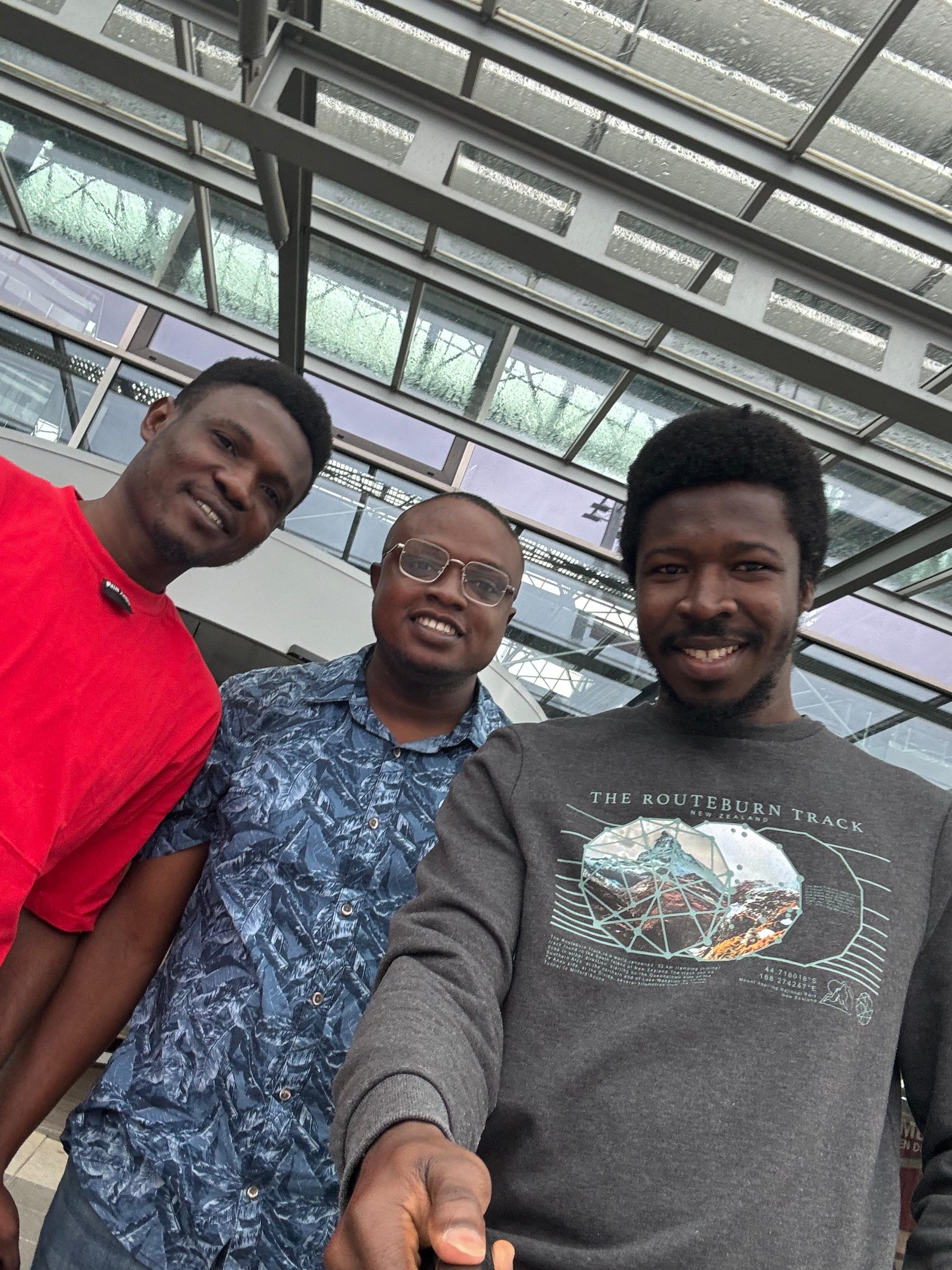 UpVoice Academy student settling in Germany, smiling outside accommodation